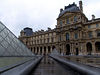 Le Louvre : The Louvre Museum (Musée du Louvre) in Paris, France, is one of the largest and most famous museums in the world. The building, a former royal palace, lies in the centre of Paris, between the Seine river and the Rue de Rivoli. Its central courtyard, now occupied by the Louvre glass pyramid, lies in the axis of the Champs-Élysées, and thus forms the nucleus from which the Axe historique springs. Part of the royal Palace of the Louvre was first opened to the public as a museum on November 8, 1793, during the French Revolution.