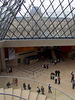 Le Louvre : The Louvre Museum (Musée du Louvre) in Paris, France, is one of the largest and most famous museums in the world. The building, a former royal palace, lies in the centre of Paris, between the Seine river and the Rue de Rivoli. Its central courtyard, now occupied by the Louvre glass pyramid, lies in the axis of the Champs-Élysées, and thus forms the nucleus from which the Axe historique springs. Part of the royal Palace of the Louvre was first opened to the public as a museum on November 8, 1793, during the French Revolution.